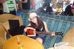 Me and my guitar with "Free Songs" sign